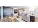 Stylish living room boasts modern fireplace, sleek built-ins, and chic seating arrangements at 463 Locust St, Denver, CO 80220