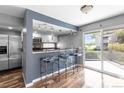 Eat-in kitchen area with bar seating and sliding doors to the outside deck at 6861 Xavier Cir # 3, Westminster, CO 80030