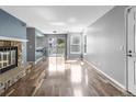 Bright living room boasts hardwood floors and a stone fireplace at 6861 Xavier Cir # 3, Westminster, CO 80030