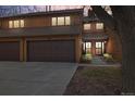 Inviting two-story townhouse featuring a private garage and a charming front entrance with beautiful wood siding at 2263 E 129Th Ave, Thornton, CO 80241