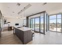 Bright kitchen featuring a large island, modern pendant lights and stunning city views at 4200 W 17Th Ave # 1013, Denver, CO 80204