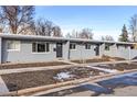 View of the gray multi-unit building with landscaped front yards and pathway, great location and curb appeal at 2405 W 39Th Ave, Denver, CO 80211