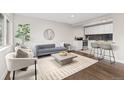 Comfortable living area with hardwood floors and ample natural light at 2405 W 39Th Ave, Denver, CO 80211