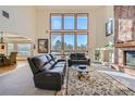 Spacious living room with a large window and fireplace at 5100 S Monaco St, Greenwood Village, CO 80111