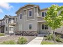 Attractive home with stone accents and a covered entry, complemented by a well-manicured front yard at 12738 Boggs St, Parker, CO 80134