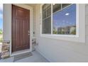 Inviting front entrance featuring a stylish door, visible house number, and decorative stone accents at 12738 Boggs St, Parker, CO 80134