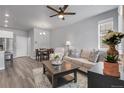 Bright living room boasts modern furniture, neutral colors, and an open layout for comfortable living at 12738 Boggs St, Parker, CO 80134
