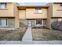 Attractive townhouse exterior with brick and siding, plus a neat front yard at 1191 S Troy St, Aurora, CO 80012