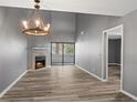 Open living room boasts a fireplace and direct access to outdoor patio at 11103 E Alameda Ave # 201, Aurora, CO 80012