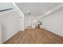 Expansive open-concept space featuring modern flooring and leading into the kitchen at 1242 Penner Dr, Erie, CO 80026