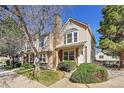 Attractive townhouse with a well-kept lawn and a welcoming front facade at 18273 E Arizona Ave # D, Aurora, CO 80017