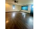 Spacious living room featuring polished hardwood floors and abundant natural light at 3101 W Jefferson Ave, Englewood, CO 80110
