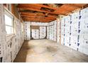 Unfinished basement with exposed beams, ready for customization and renovation at 3301 Bellaire St, Denver, CO 80207