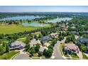 Desirable neighborhood with mature trees, manicured lawns, and beautiful lake views at 5722 S Benton Way, Littleton, CO 80123