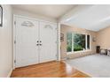 Inviting foyer with hardwood floors and decorative double doors at 6407 S Heritage W Pl, Centennial, CO 80111