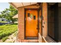Inviting front entrance with a unique door and brick surround, adding character to the home at 1195 Boston St, Aurora, CO 80010