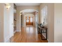 Inviting home foyer with hardwood floors, natural light and beautiful arched entryways at 913 Alkire Ct, Golden, CO 80401