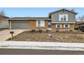 Charming split-level home with brick and siding exterior, attached garage, and a well-maintained front yard at 7074 Yates St, Westminster, CO 80030