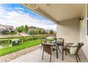 Relaxing patio with wicker furniture, perfect for outdoor dining at 9769 W Stanford Ave, Denver, CO 80123