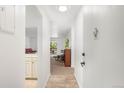 Inviting hallway leads to a cozy living area with bright natural light at 14300 E Marina Dr # 306, Aurora, CO 80014