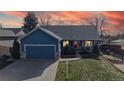 Inviting exterior view of a well-maintained home with an attached garage and manicured lawn at 8910 Rutgers St, Westminster, CO 80031
