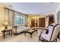 Elegant living room with plush seating, large windows, and stylish decor, creating a comfortable and sophisticated atmosphere at 3724 S Poplar St, Denver, CO 80237