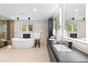 Modern bathroom featuring a soaking tub, sleek vanity, and marble accents at 4505 S Yosemite St # 362, Denver, CO 80237