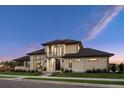 Modern two-story home exterior features stone accents, a dark roof, and lush landscaping at 14545 Lipan St, Westminster, CO 80023