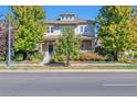 Charming home with a well-manicured front yard and a welcoming entrance at 8537 E 35Th Ave, Denver, CO 80238