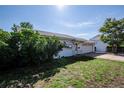 Side view of a cozy single-story house featuring a lush green lawn and an attached garage at 505 Maple St, Golden, CO 80403
