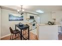 Bright kitchen with a dining table and blue mountain wall art at 20 S Boulder Cir # 2303, Boulder, CO 80303