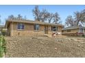 All-brick home with mature trees and landscaping creates an inviting curb appeal at 7950 Maria St, Westminster, CO 80030