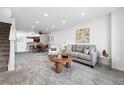Bright living room with open floorplan, modern decor, and plenty of natural light at 3300 W Florida Ave # 117, Denver, CO 80219
