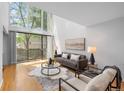 Inviting living room with stylish furnishings, large windows, and natural light at 1050 S Monaco Pkwy # 68, Denver, CO 80224