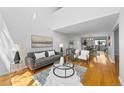 Spacious living area with modern decor, plush seating, and hardwood floors at 1050 S Monaco Pkwy # 68, Denver, CO 80224