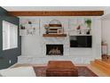 Cozy fireplace with stone surround and built-in shelving, creating a warm and inviting atmosphere at 9790 E 5Th Ave, Aurora, CO 80010