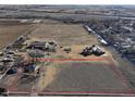 Aerial view showing the property outline and surrounding landscape at 724 County Road 37, Brighton, CO 80603