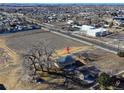 Expansive aerial view of the property showcasing its location and surrounding neighborhood, with trees near property at 724 County Road 37, Brighton, CO 80603