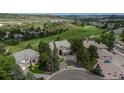 Luxurious home boasts an expansive lot near a lush green golf course at 171 October Pl, Castle Rock, CO 80104