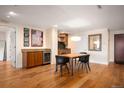 Stylish dining room with hardwood floors and a built-in bar, ideal for hosting dinner parties at 1411 Wynkoop St # 804, Denver, CO 80202