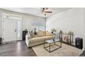 Cozy living room with ample natural light, stylish furniture, and hardwood floors for modern living at 1492 Red Cliff Way, Castle Rock, CO 80109