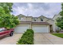 Inviting townhome with a two-car garage and well-maintained landscaping, perfect for comfortable living at 5546 S Quemoy Cir, Aurora, CO 80015