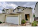Beautiful townhome featuring a two-car garage, lovely landscaping, and inviting curb appeal in a great neighborhood at 5546 S Quemoy Cir, Aurora, CO 80015