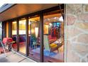 Open living room shows natural light and stone exterior at 3650 Chimayo Rd, Littleton, CO 80123