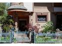 Inviting home exterior featuring decorative stonework, charming front garden, and a turret-style entryway at 1022 N Pearl St # 101, Denver, CO 80203