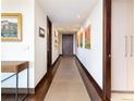Hallway featuring contemporary art, recessed lighting and rich hardwood trim at 1133 14Th St # 3320, Denver, CO 80202