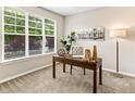 Bright office with a large window, modern desk, decor, and comfortable seating for remote work at 1836 S Kendall Ct, Lakewood, CO 80232