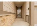 Front entrance with a security door and stone accents at 27957 E 9Th Dr, Aurora, CO 80018