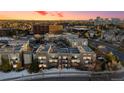 Breathtaking aerial view of the condos with scenic landscape and beautiful sunset, showing a desirable location at 5677 S Park Pl # C208, Englewood, CO 80111