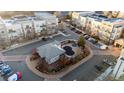 Aerial view of community pool, clubhouse and parking, highlighting amenities and convenient parking at 5677 S Park Pl # C208, Englewood, CO 80111